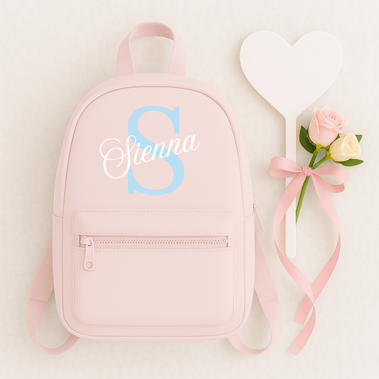 Personalised children's backpack customised with your child's name and initial. Available in a range of colours and font styles. Perfect for nursery, preschool, reception, school and back to school gifts.