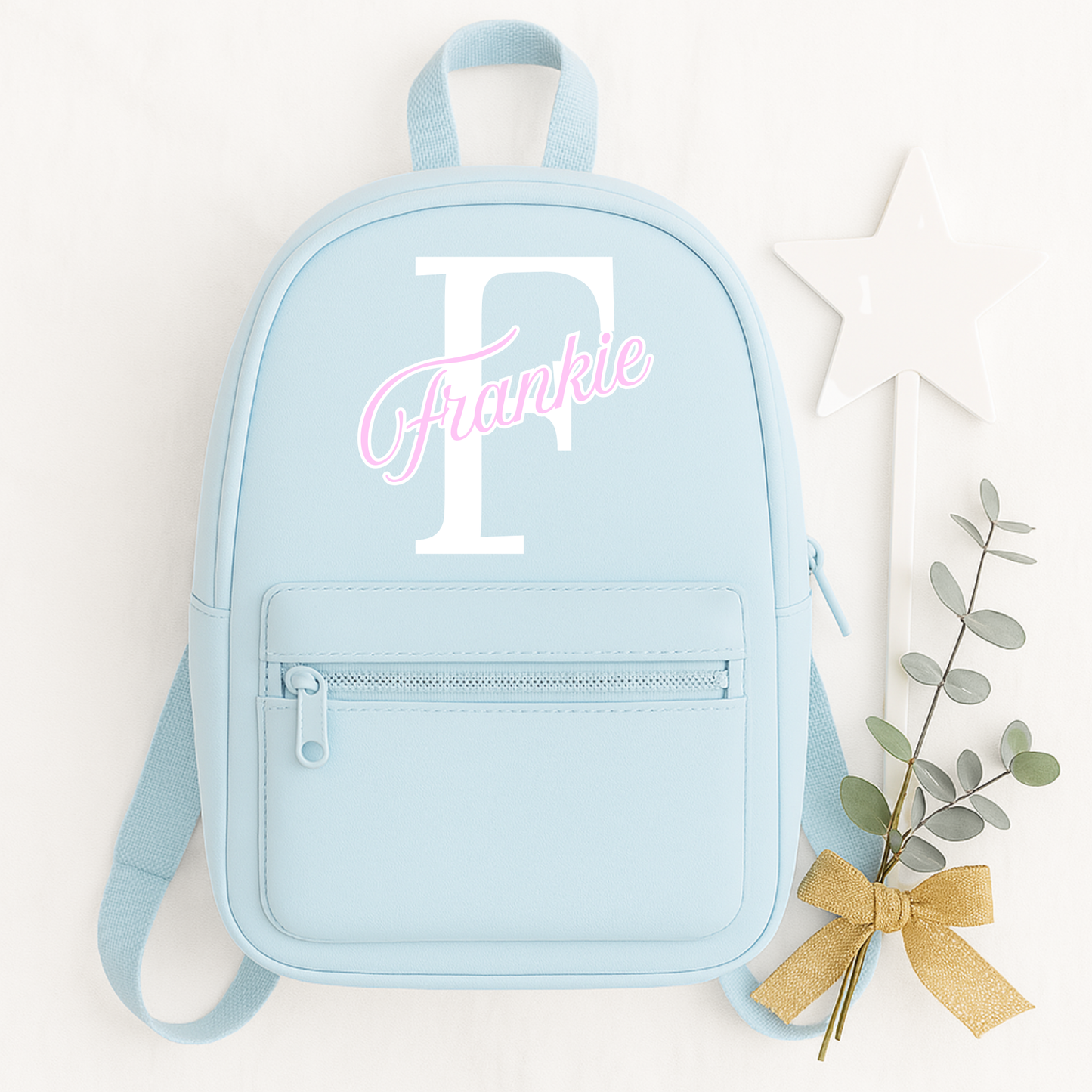 Personalised children's backpack customised with your child's name and initial. Available in a range of colours and font styles. Perfect for nursery, preschool, reception, school and back to school gifts.