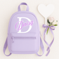 Personalised children's backpack customised with your child's name and initial. Available in a range of colours and font styles. Perfect for nursery, preschool, reception, school and back to school gifts.